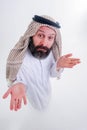 Arabic man in national dress smiles and is surprised. Mouth and eyes wide open. Emotions colorful people Royalty Free Stock Photo