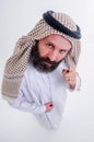 Arabic man in national dress smiles and is surprised. Mouth and eyes wide open. Emotions colorful people Royalty Free Stock Photo