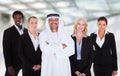 Arabic man standing with businesspeople Royalty Free Stock Photo