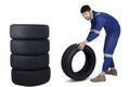 Arabic mechanic pushing a tire Royalty Free Stock Photo