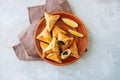 Arabic and middle eastern food concept. Fatayer sabanekh - traditional arabic spinach triangle hand pies on a white stone Royalty Free Stock Photo