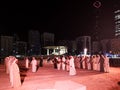 Arabic Middle Eastern men performing a traditional dance in Abu Dhabi, UAE at night