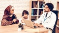 Arabic Mother with Son at Doctor`s Appointment Royalty Free Stock Photo