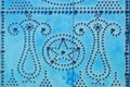 Arabic ornament on the blue door, background. Texture of Islamic symbols in Sidi Bou said, Tunisia, Africa