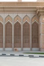 Arabic Pattern Wall of The Building with Tree at Dubai Royalty Free Stock Photo