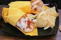 Arabic pita with chicken, cheese, tomato and potato chips - breakfast, brunch plate Royalty Free Stock Photo