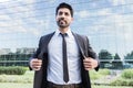 Arabic businessman or worker standing in suit near office building Royalty Free Stock Photo