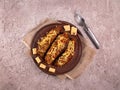 Arabic recipe stuffed eggplants with red lentils, chicken meat, tomato, onion and cheese