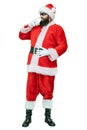Arabic Santa with black beard drinks milk. Santa Claus is drinking glass of milk on white background. Christmas coming