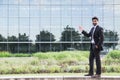 Businessman or worker standing in suit near office building Royalty Free Stock Photo