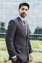 Businessman or worker standing in suit near office building Royalty Free Stock Photo