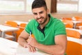 Arabic Student With Books Sitting In Classroom Royalty Free Stock Photo