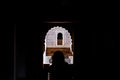 Arabic style ancient arch silhouette with person silhouette on an old arabic style building in Marrakesh