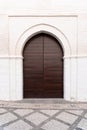 Arabic style wooden door in the city of Granada. Royalty Free Stock Photo