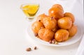 Arabic sweet round dessert Lokma with nuts