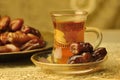 Arabic tea cup and dates Royalty Free Stock Photo