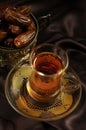 Arabic tea cup and dates Royalty Free Stock Photo