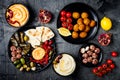 Arabic traditional cuisine. Middle Eastern meze platter with pita, olives, hummus, stuffed dolma, labneh cheese balls, falafel.