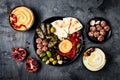 Arabic traditional cuisine. Middle Eastern meze platter with pita, olives, hummus, stuffed dolma, labneh cheese balls in spices. Royalty Free Stock Photo