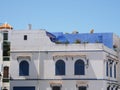 Arabic white building with blue windows in african medina of Asilah town in Morocco Royalty Free Stock Photo