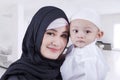 Arabic woman and her son at home Royalty Free Stock Photo