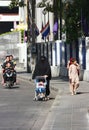 Arabic woman pushing a baby stroller