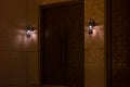 Arabic wooden door at night with decorative light lamps