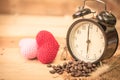 Arabica coffee bean with vintage clock Royalty Free Stock Photo