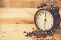 Arabica coffee bean with vintage clock Royalty Free Stock Photo