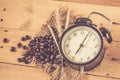 Arabica coffee bean with vintage clock Royalty Free Stock Photo