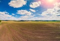 Arable field with beautiful sky. Springtime Royalty Free Stock Photo
