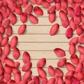 Arachis or peanuts background with red scattered nuts and beans