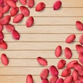 Arachis or peanuts background with red scattered nuts and beans