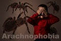 Arachnophobia concept. Double exposure of scared boy and spiders