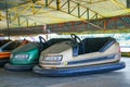 ARAD, ROMANIA, 12 APRIL, 2024: Colorful bumper cars in amusement park waiting for the summer season to open.