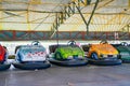 ARAD, ROMANIA, 12 APRIL, 2024: Colorful bumper cars in amusement park waiting for the summer season to open.