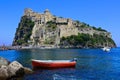 Aragonese Castle with boat off the island of Ischia, Italy Royalty Free Stock Photo