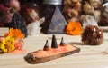 Aragonite Crystal With Incense and Stone Pyramid on Meditation Altar