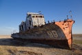 Aral sea disaster. Abandoned rusty fishing boat at the desert on the place of former Aral sea Royalty Free Stock Photo