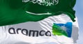 Aramco and Saudi Arabia waving in the wind on a clear da