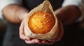 Arancini balls in craft paper bag in the man& x27;s arms Royalty Free Stock Photo