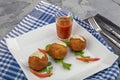 Arancini - delicious hot italian arancini. Saffron rice balls stuffed with melted cheese topped with grated parmesan cheese and