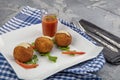 Arancini - delicious hot italian arancini. Saffron rice balls stuffed with melted cheese topped with grated parmesan cheese and