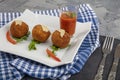 Arancini - delicious hot italian arancini. Saffron rice balls stuffed with melted cheese topped with grated parmesan cheese and