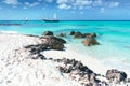 Arashi Beach Aruba Caribbean Sea sand rocks crystal clear turquoise water boats Royalty Free Stock Photo