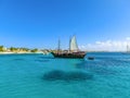 Tourists snorkeling along the coastline and enjoy the tropical island of Aruba