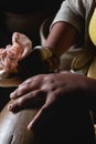 Potter hands cleaning ceramic pieces in Maragoipinho