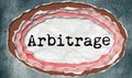 Arbitrage - typewritten word in ragged paper hole background