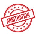 ARBITRATION text written on red vintage round stamp