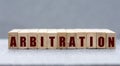 ARBITRATION - word on wooden bars on a gray background